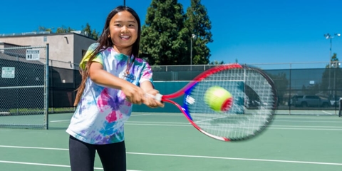 Young Girl Playing Tennis