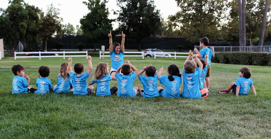 Amazing Athletes Kids in a line with Coach