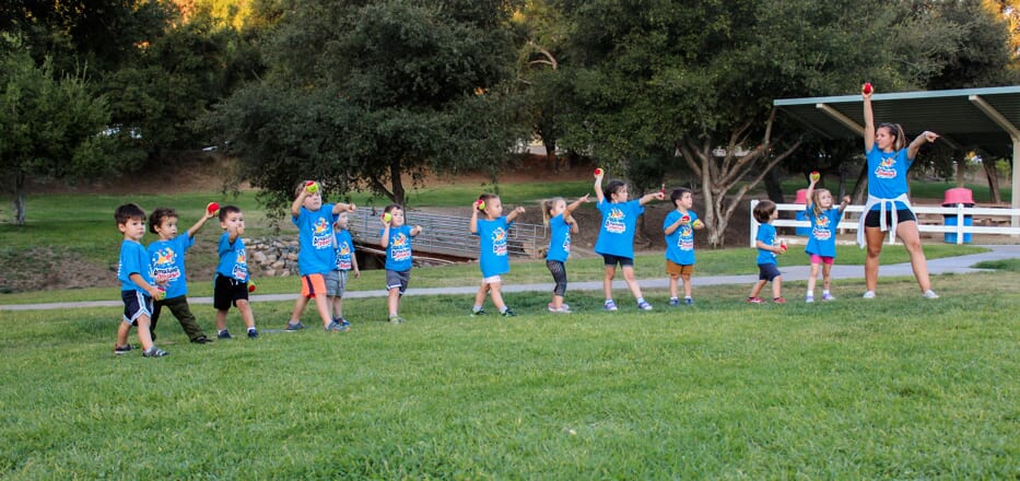 Amazing Athletes Kids in a line with Coach